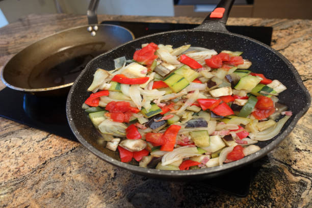 istock Pan-fried mixed vegetables in portions while cooking in a wok 2179599747