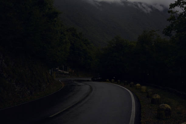 istock Mountain road in the rain 2179603285