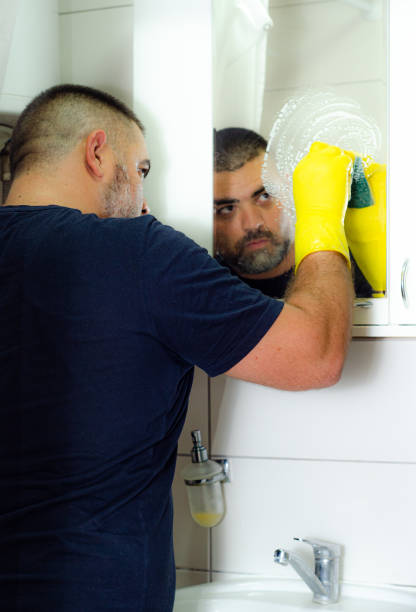 istock A man is cleaning the bathroom. 2179604089