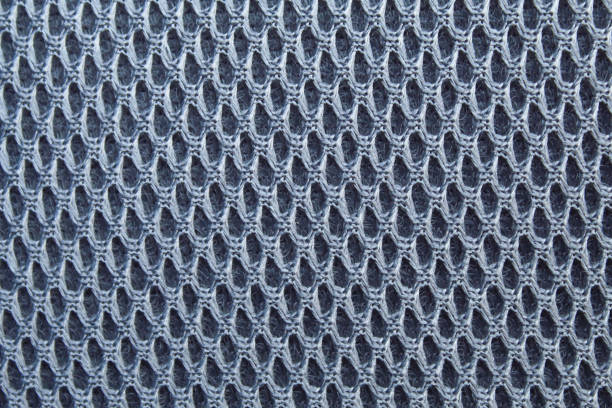 perforated pattern on gray cloth. perforated motif fabric texture for background