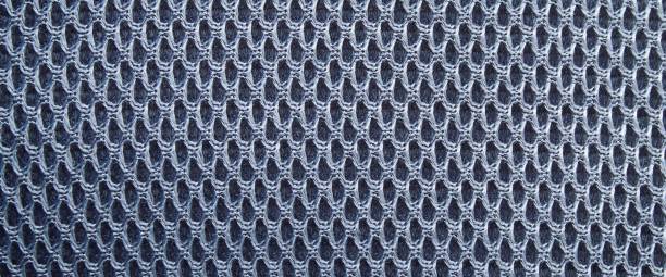istock perforated pattern on gray cloth. perforated motif fabric texture for background 2179605754