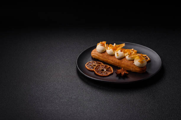 istock Sweet dessert eclairs or profiteroles with chocolate filling 2179607764
