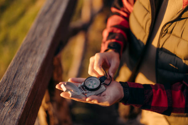 istock Close up of Hiker hiking in forest using navigational equipment 2179607978