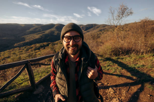 istock Shot of a young man taking selfies while hiking up a mountain 2179609870
