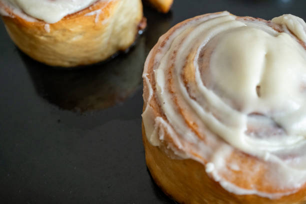 istock close-up cinnamon rolls in sunlight and wooden ground 2179612642