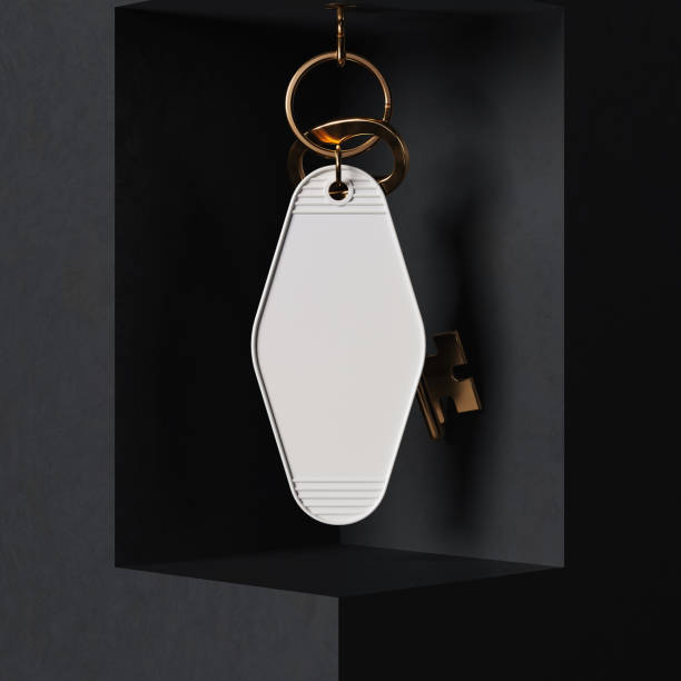 istock Hanging keychain with gold vintage key mockup. 3D rendering 2179614689