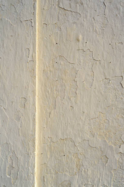 Relief line in white stucco wall outdoors