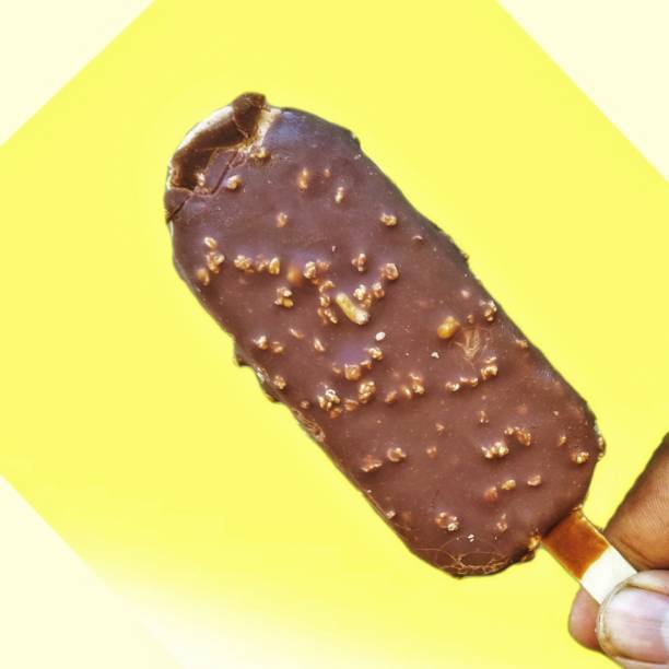 istock Men Holding Ice cream with yellow background 2179616937
