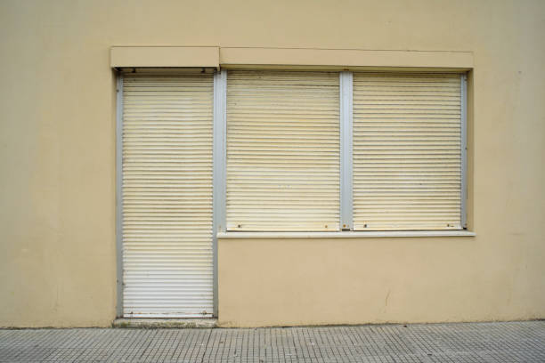 istock Closed blinds in door and windows in shop facade 2179618550