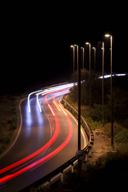Road at night with light trails from cars in Almeria