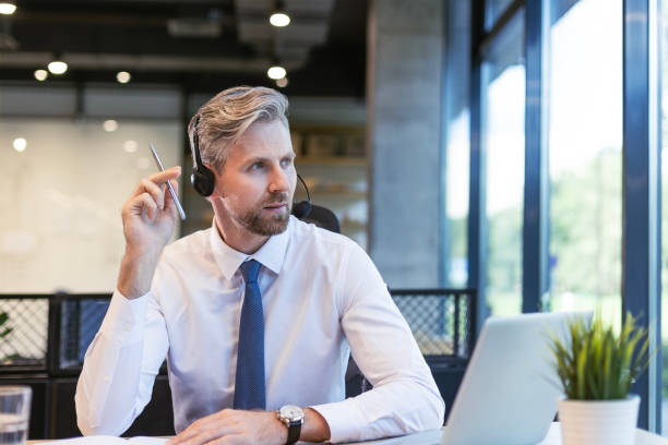 istock Happy young male customer support executive working in office. 2179622618