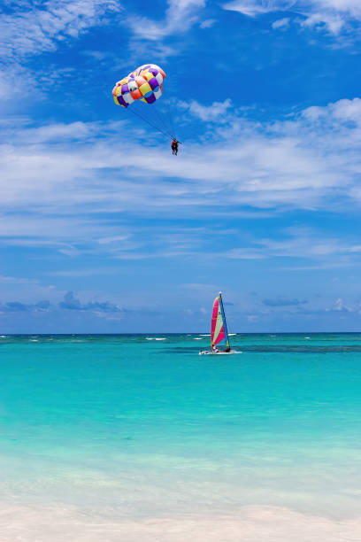 Parasailing and windsurfing in the ocean.