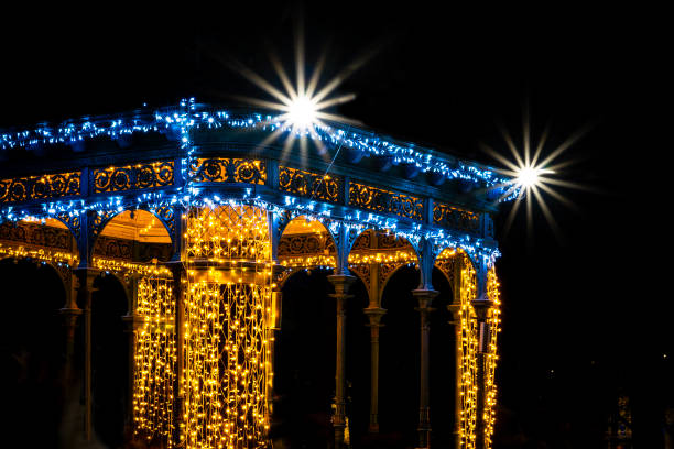 istock Pavilion illuminated with Christmas lights next to an ice rink at night 2179625711