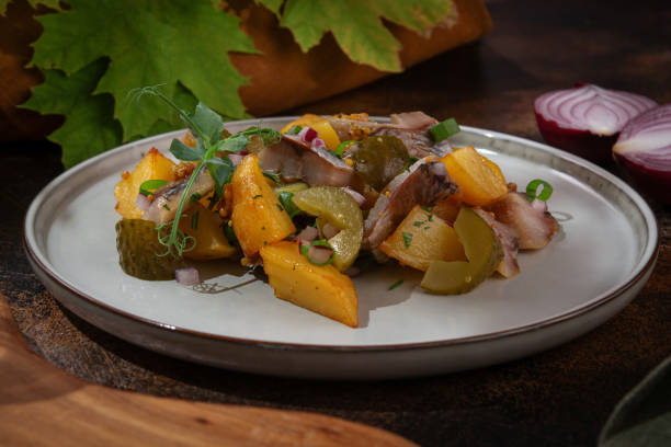 istock Russian cuisine. Potatoes with herring and pickled cucumbers 2179629726