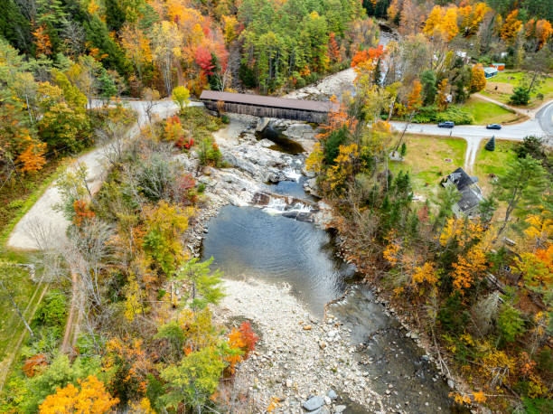 istock Swiftwater Covered Bridge and Ammonoosuc River, Highway NH-112 View in Swiftwater, Bath, New Hampshire, USA 2179633021