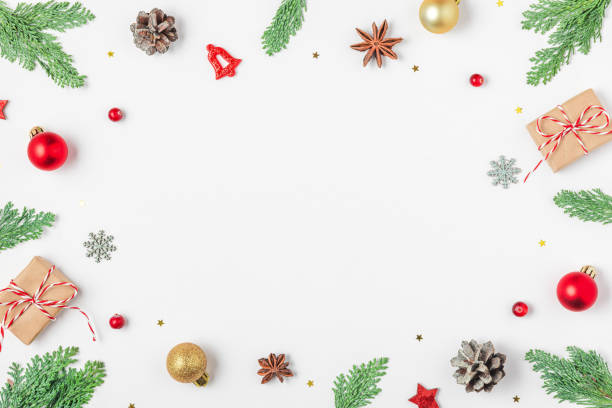 istock Christmas composition. Frame made of fir branches, gift boxes, golden and red decorations, pine cones on white background. Flat lay. Happy New Year and winter holidays background. Top view 2179642338