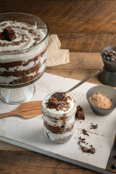 istock Chocolate brownie trifle bowl with ingredients on white tray in a rustic kitchen. 2179645403