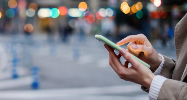 Young woman with smartphone in her hands