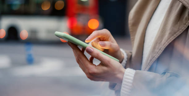 istock Young woman with smartphone in her hands 2179646244