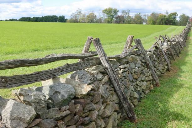 istock Old Fashioned Stone And Wooden Fence 2179649109
