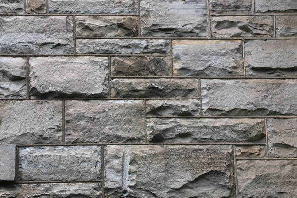 istock Closeup of a brick building with irregularly sized bricks 2179649812