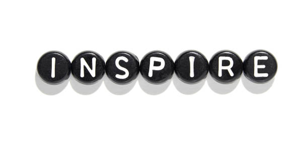 istock Inspire word in black letter beads on white background for motivation 2179654358