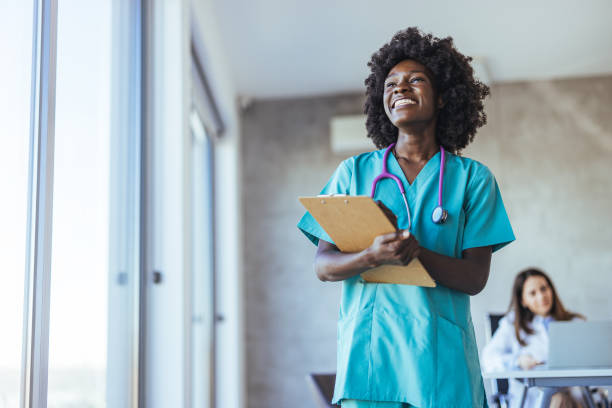 istock Confident Nurse With Clipboard Smiling in Hospital Setting 2179654638