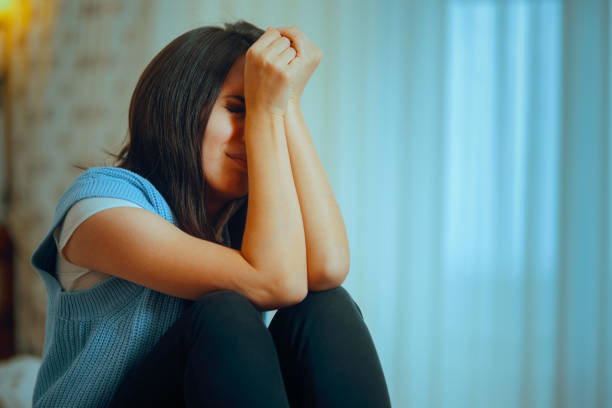 A person going through personal trauma coping in tears