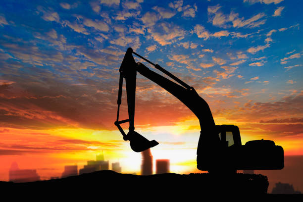 istock Crawler excavators silhouette are digging the soil . 2179659998