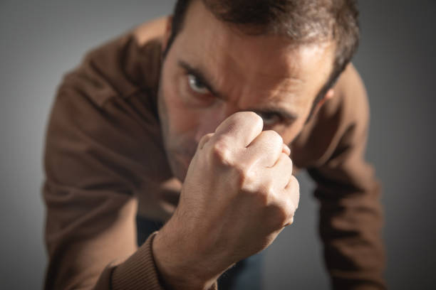 portrait of asian man wearing blue shirt being angry