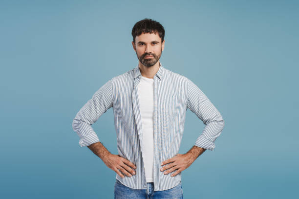 istock Smiling, handsome hispanic man wearing stylish blue shirt looking at camera, advertisement concept 2179675915