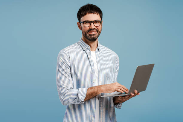 istock Successful businessman, freelancer wearing eyeglasses using laptop, copywriter typing on keyboard 2179675934