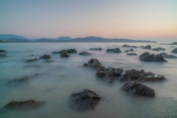 Long exposure of rocks on the coast in the evening