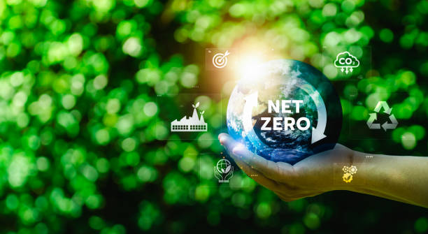 istock Hand Holding Planet Earth with Net Zero Text Surrounded by Eco-Friendly Icons Representing Carbon Emission Reduction, Renewable Energy, Recycling, and Environmental Sustainability 2179679023
