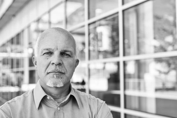 istock Senior it professional standing outside office building 2179680848
