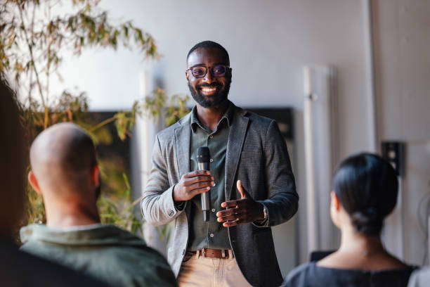 istock Business Conference Speaker Engaging Audience with Inspiring Presentation 2179684390