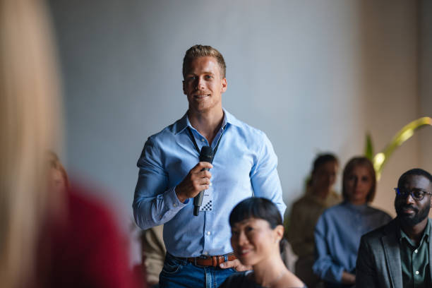 istock Confident Speaker Engages Audience During Seminar or Conference Event 2179684402