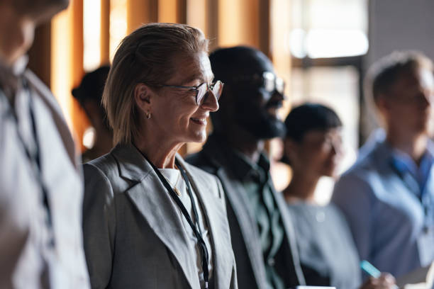 istock Diverse Group of Professionals Attending Business Conference Lecture 2179684405