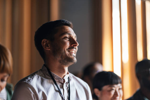 istock Smiling Attendee in a Business Conference Setting 2179684410