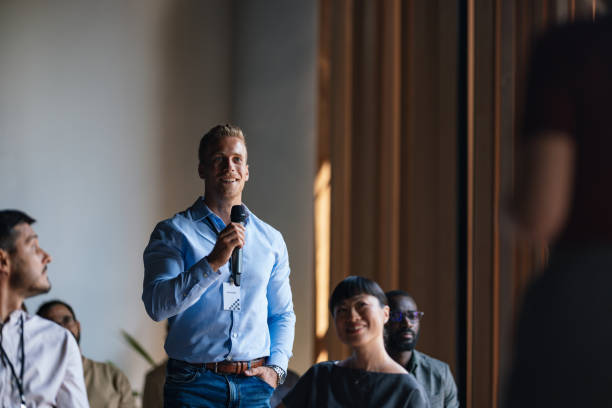 istock Confident Speaker Engaging Audience During Business Conference 2179684415