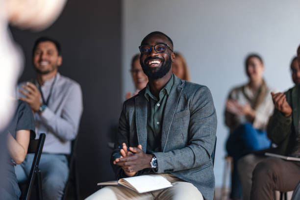 Engaged Audience Member Applauding At Business Conference