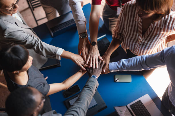 istock Diverse Business Team Uniting Hands in Collaborative Meeting 2179684444