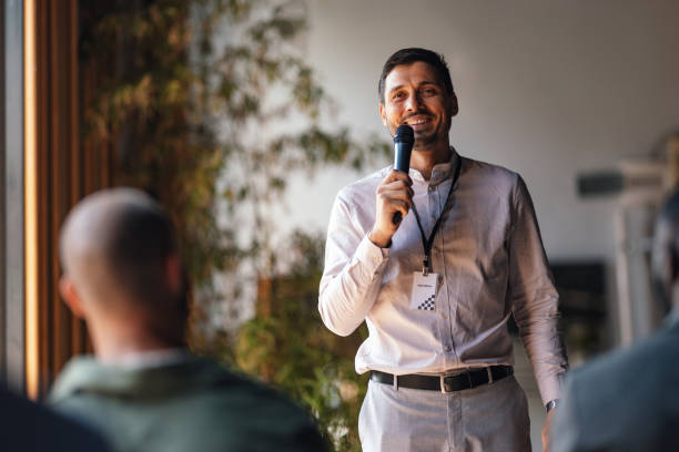 istock Confident Speaker Addressing Business Conference Audience 2179684486