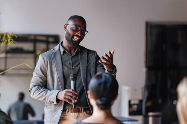istock Confident Businessman Giving a Presentation at a Business Conference 2179684495
