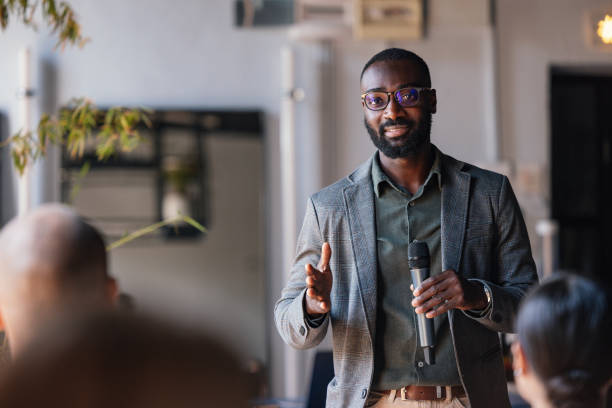 istock Confident Speaker Addressing a Business Conference Audience 2179684498