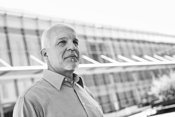 istock Senior manager looking up with hope black and white portrait 2179688596