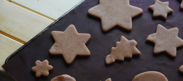 istock Cookies Gingerbread Star Shaped Overhead View Brown Holiday Dough 2179688755