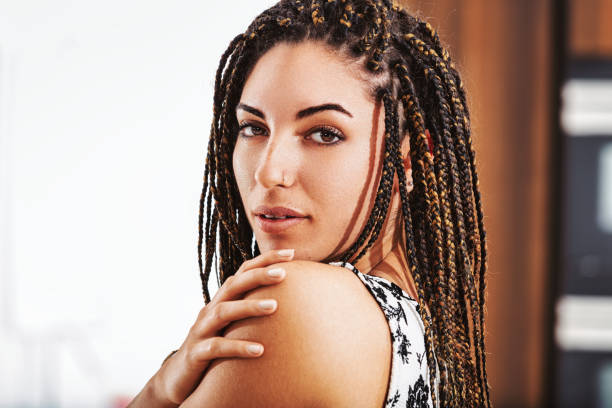 istock Attractive young woman with braids is posing at home 2179689799