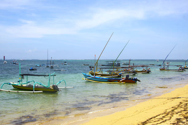 Traditional boats Jukung along the Sanur Beach in Bali, Indonesia