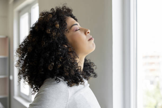 Young woman relaxing breathing fresh air
